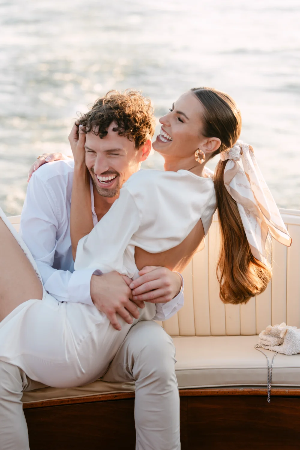 Happy newly weds on a boat. Photo taken by C.Mae photography at Lake Geneva