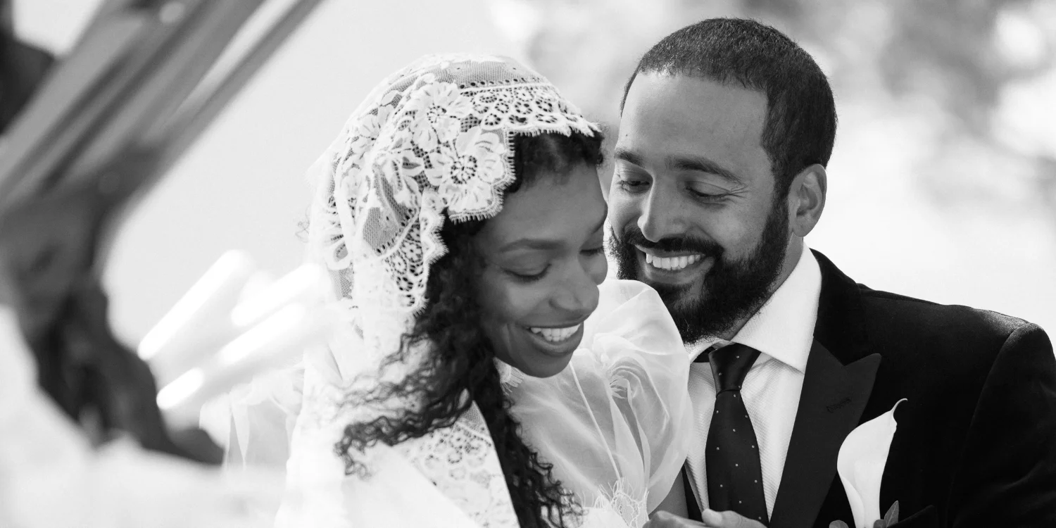 Happily wed couple caressing each other. Photo shot by C.Mae photography.